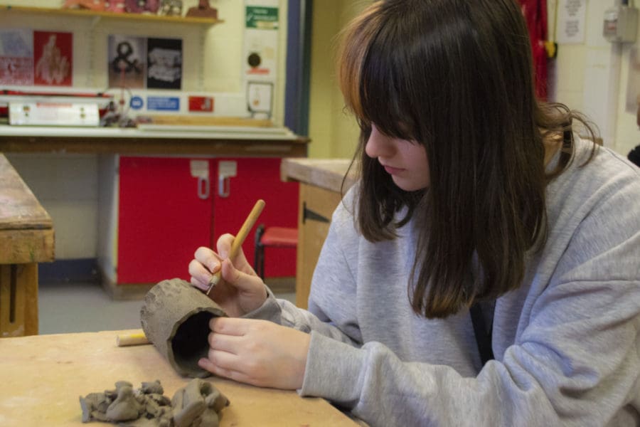 Art student working with clay